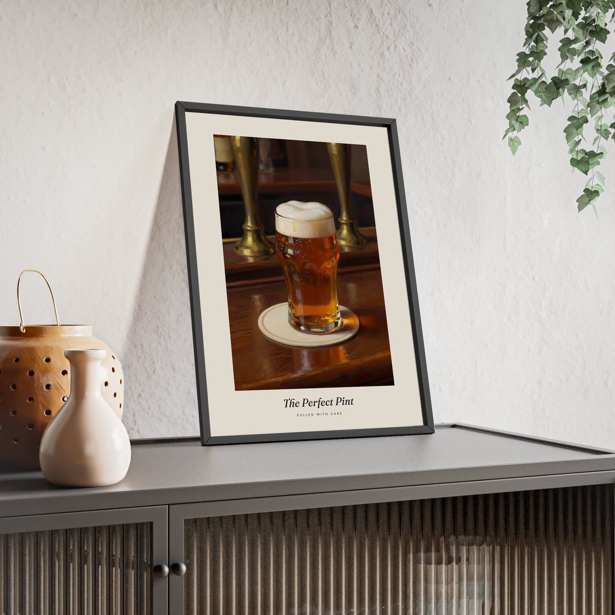 The Perfect Pint Print framed and leaning on a sideboard