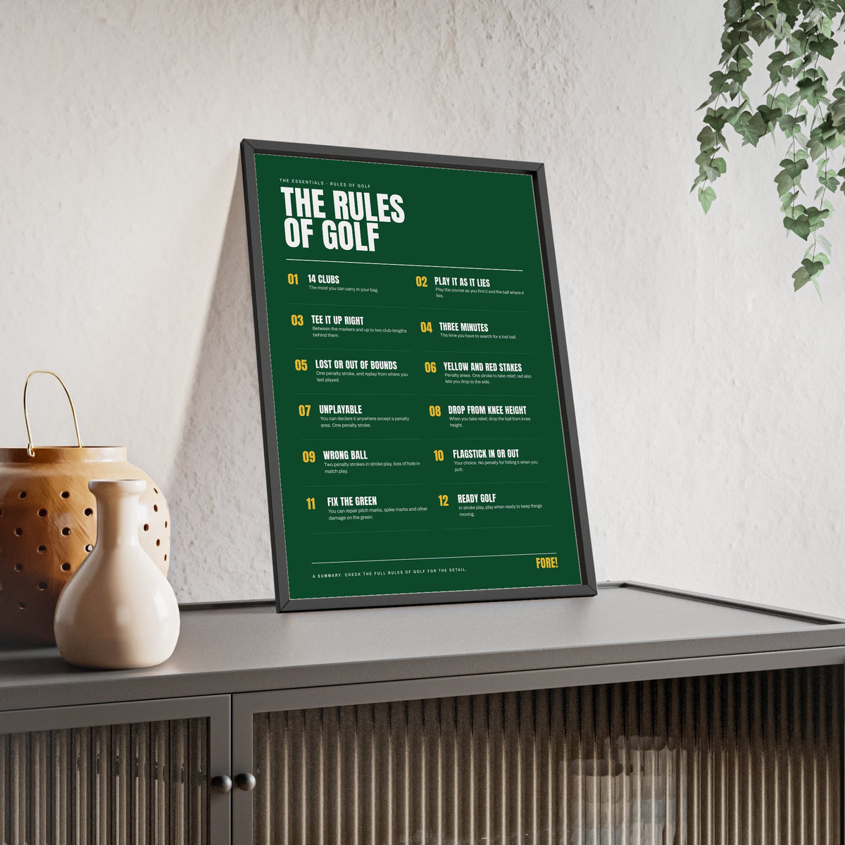 The Rules of Golf print framed and leaning on a sideboard
