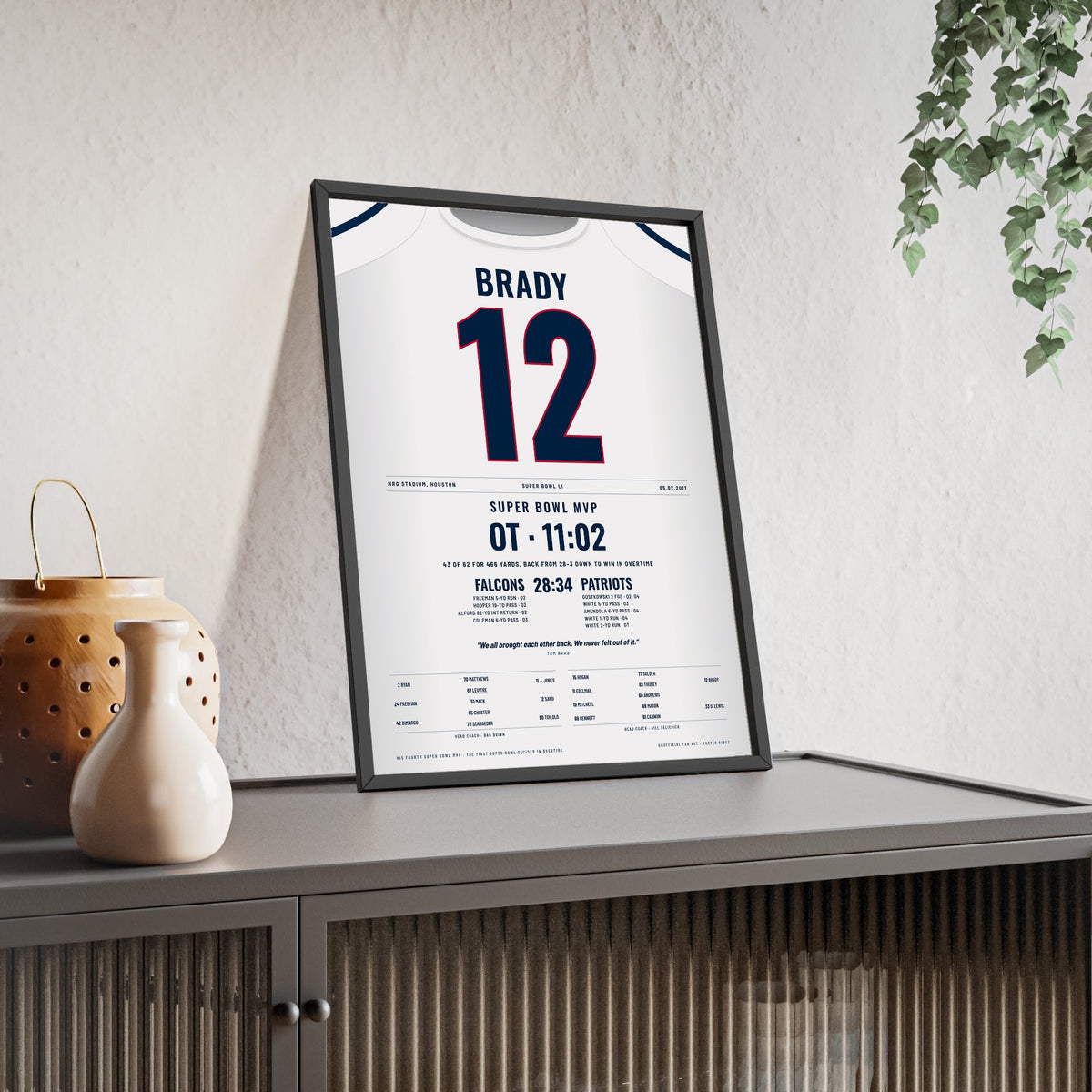 Tom Brady Super Bowl LI MVP Poster - New England Patriots 12 Overtime Comeback Jersey Print framed and leaning on a sideboard