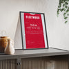 Tommy Fleetwood East Lake 2025 Golf Poster - Caddie Bib First Win Print framed and leaning on a sideboard