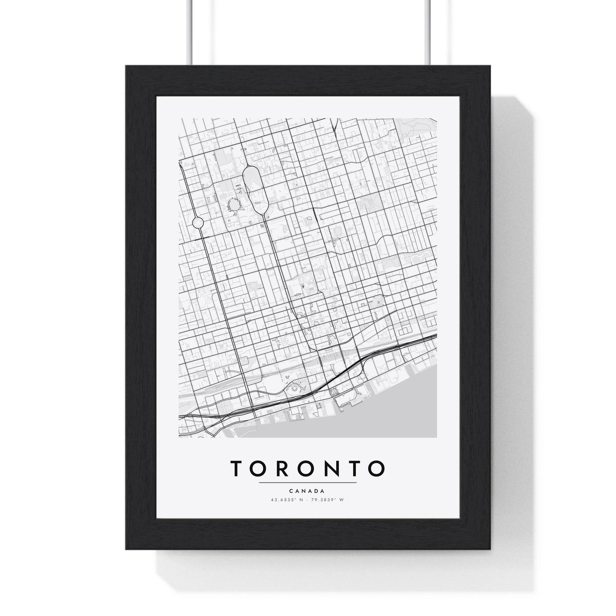 Toronto street map poster in white, minimal city map print framed in a black frame