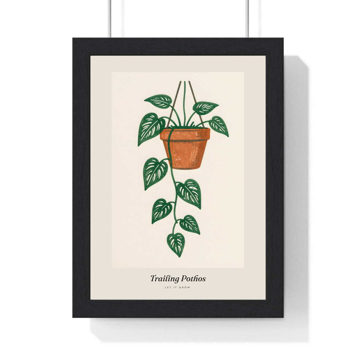 Trailing Pothos Lino Print framed in a black frame, ready to hang