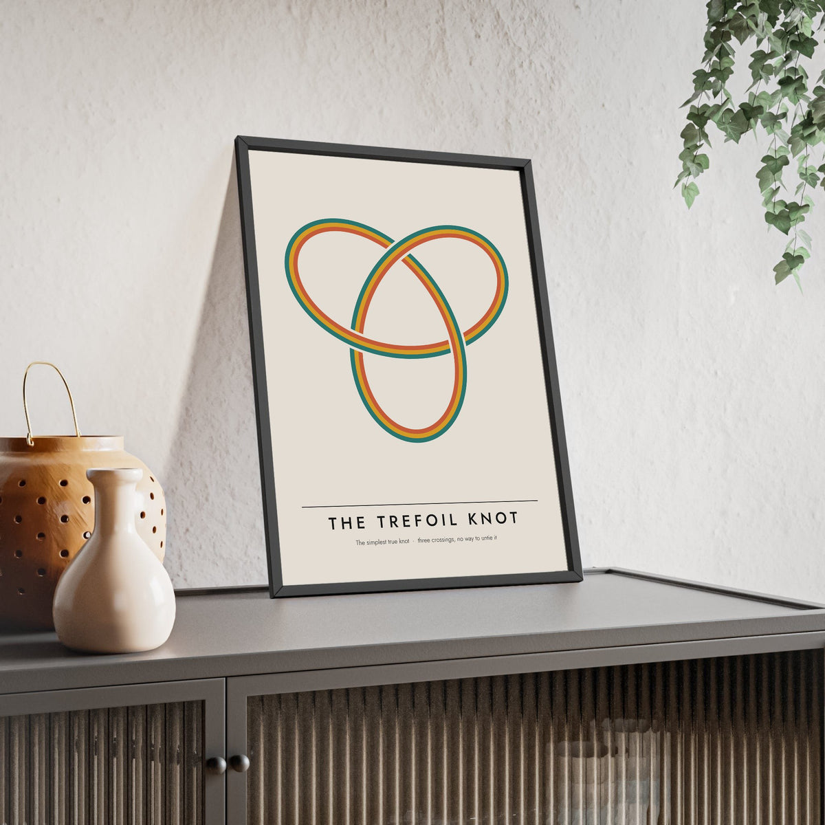 Trefoil Knot print framed and leaning on a sideboard