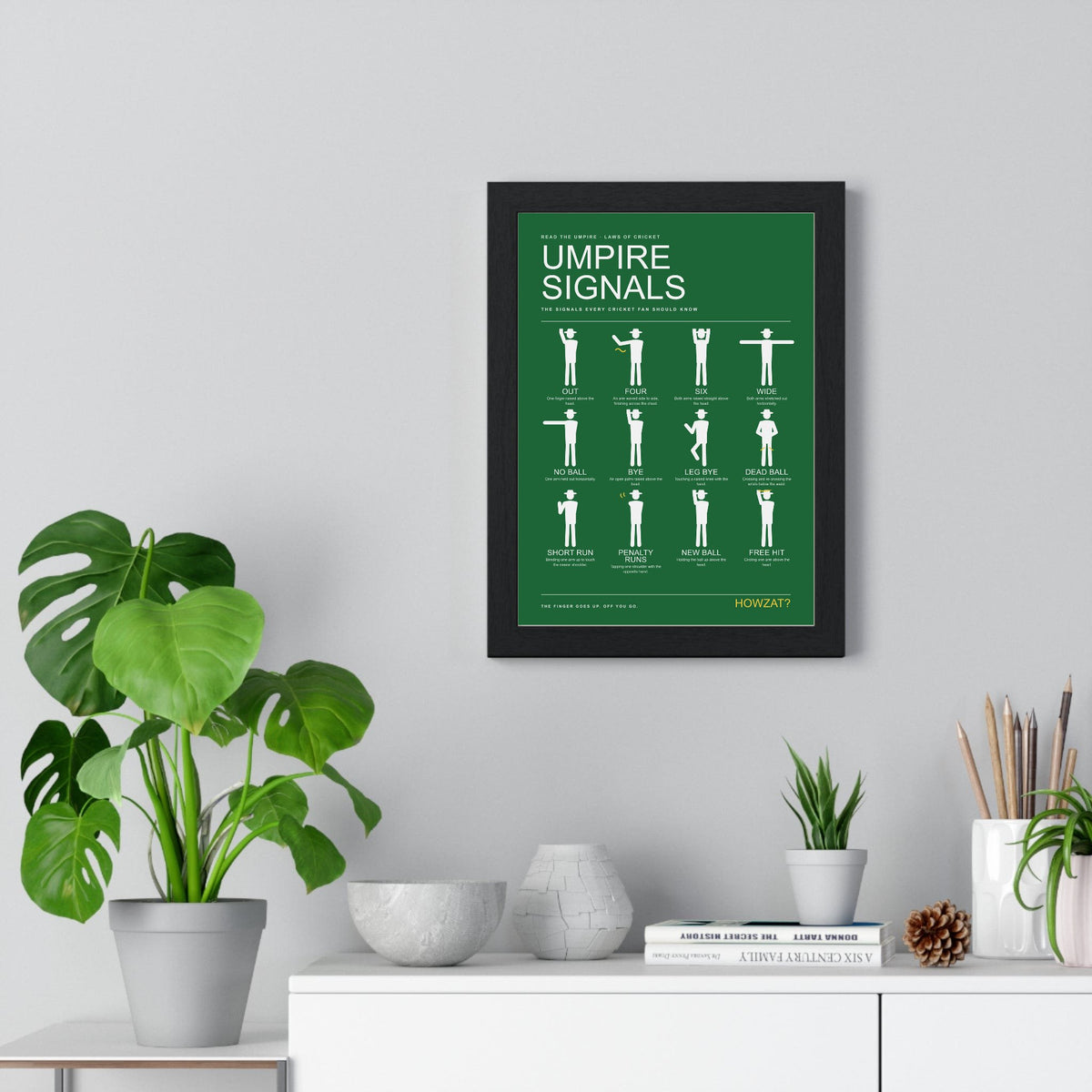 Cricket Umpire Signals print framed on a living room wall