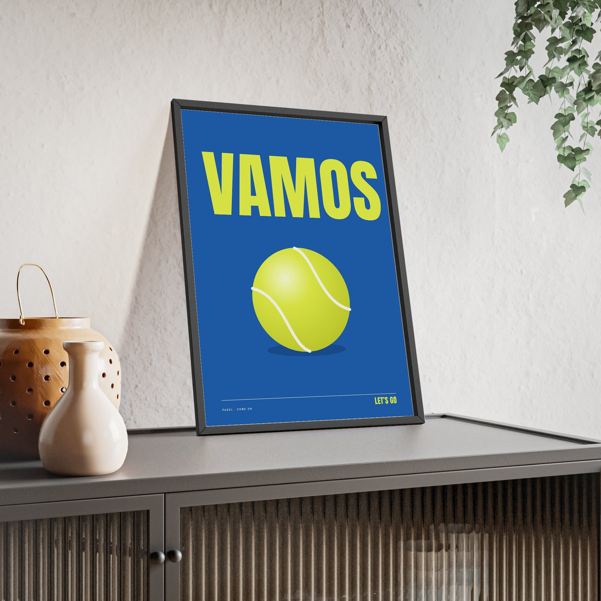 Vamos Padel print framed and leaning on a sideboard