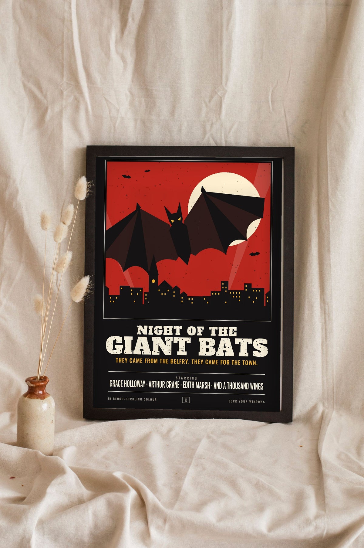 Vintage Horror Bat Poster - black version leaning in a frame