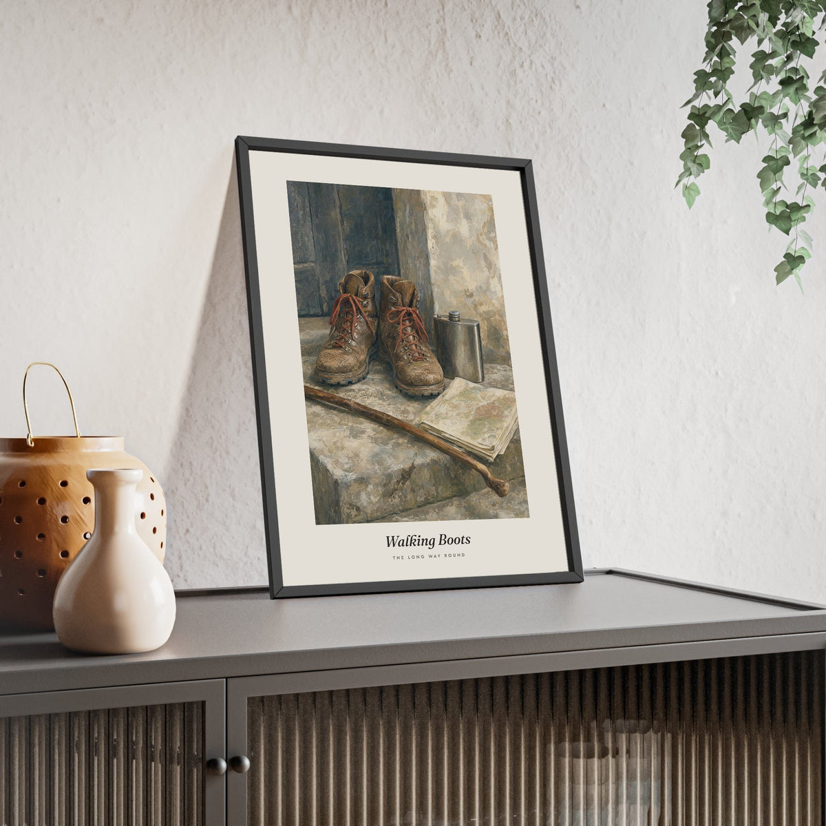 Walking Boots Print framed and leaning on a sideboard