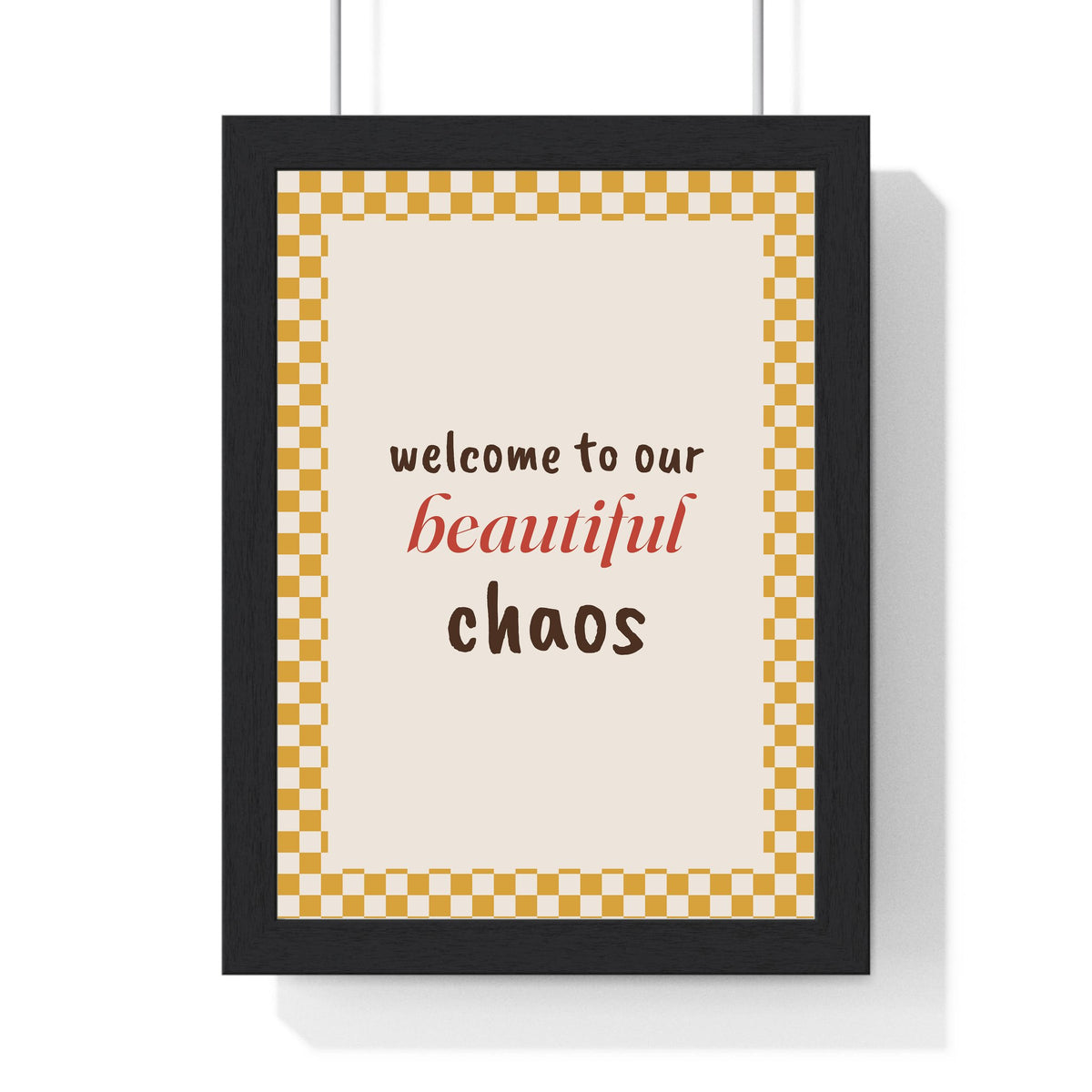 Welcome to Our Beautiful Chaos Print framed in a black frame, ready to hang