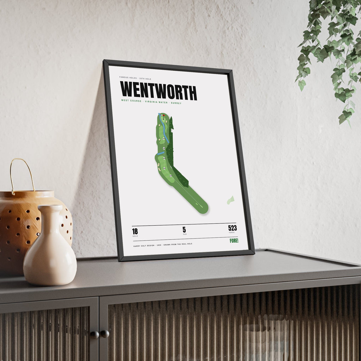 Wentworth 18th Hole White print framed and leaning on a sideboard