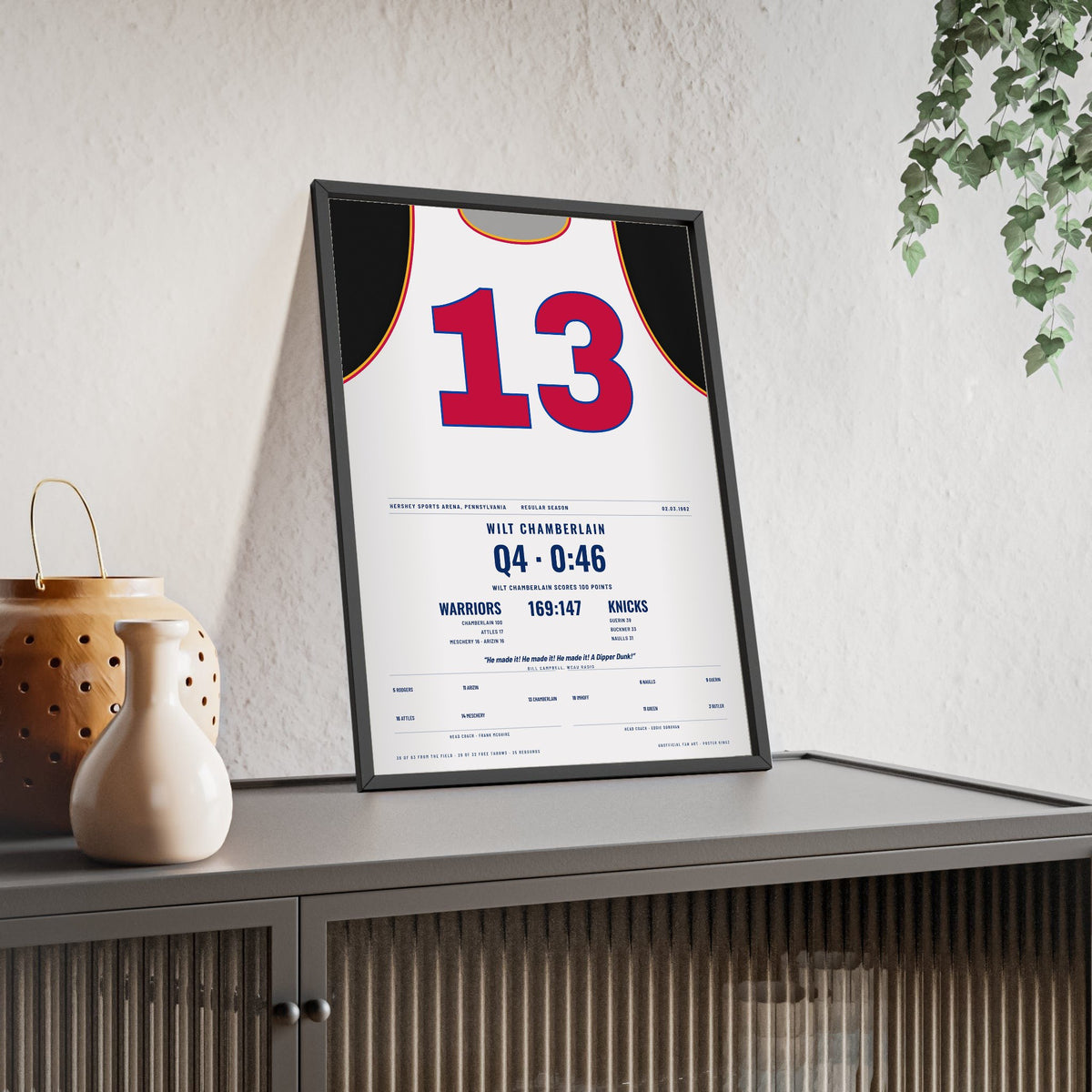 Wilt Chamberlain 100 Points 1962 Poster - Philadelphia Warriors 13 Jersey Print framed and leaning on a sideboard