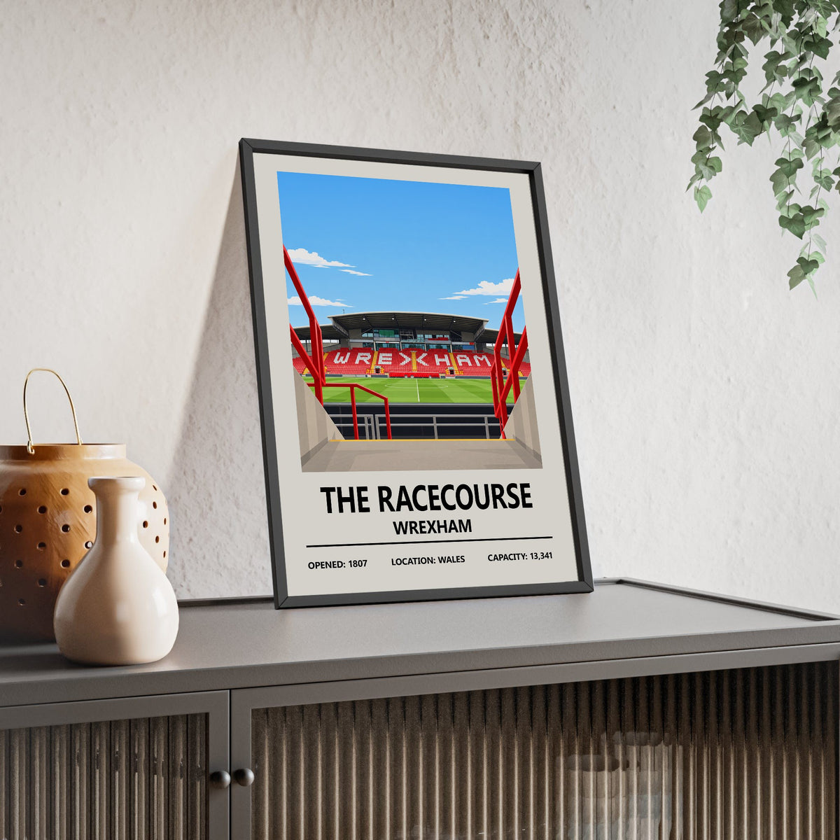 Wrexham The Racecourse Ground print framed and leaning on a sideboard
