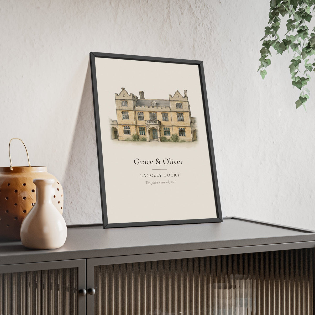Wedding venue illustration from photo: a stone manor house painted in watercolour and ink, with the couple names, venue name and wedding date, framed anniversary print