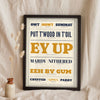 Yorkshire Slang Print in a black frame propped up on linen